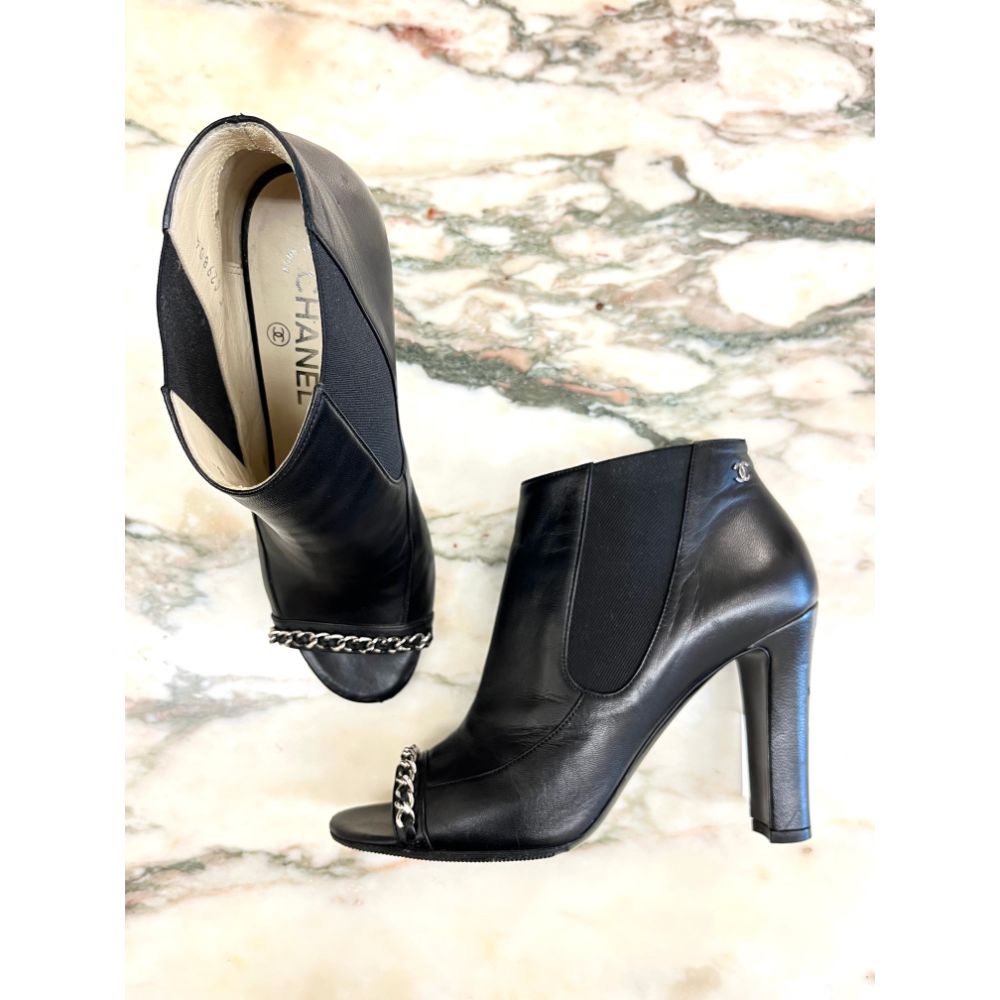 Chanel black leather ankle boots with chain detail