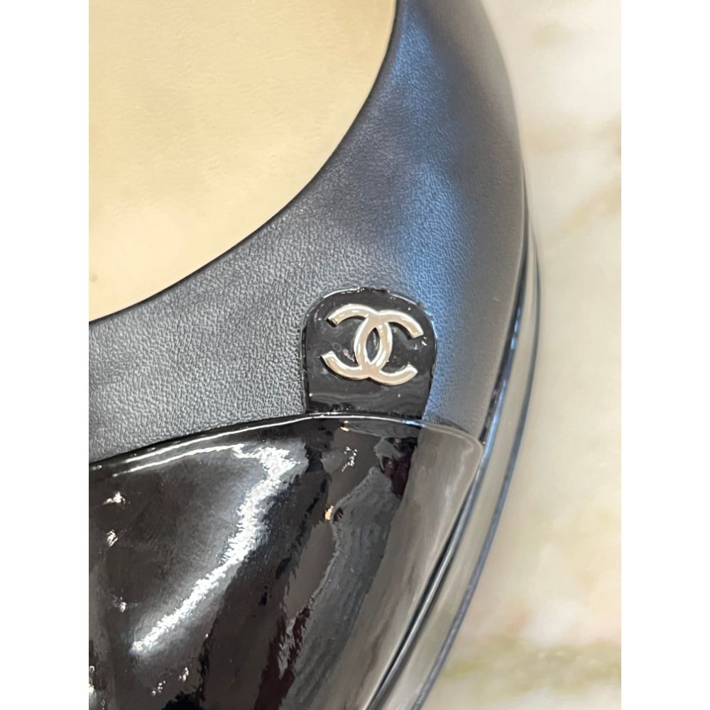 Chanel black leather pumps with patent toe