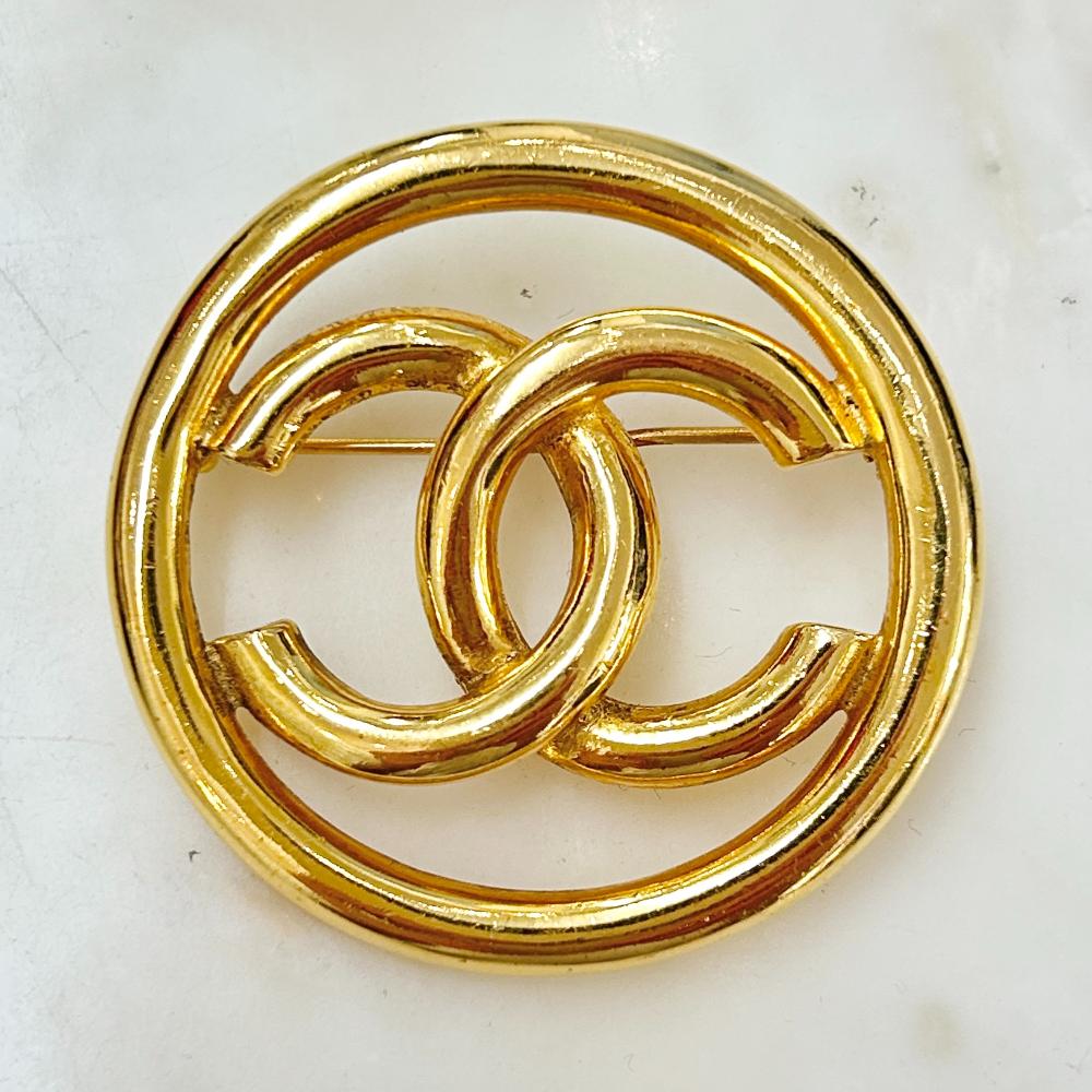Chanel 1993 gold circle logo brooch