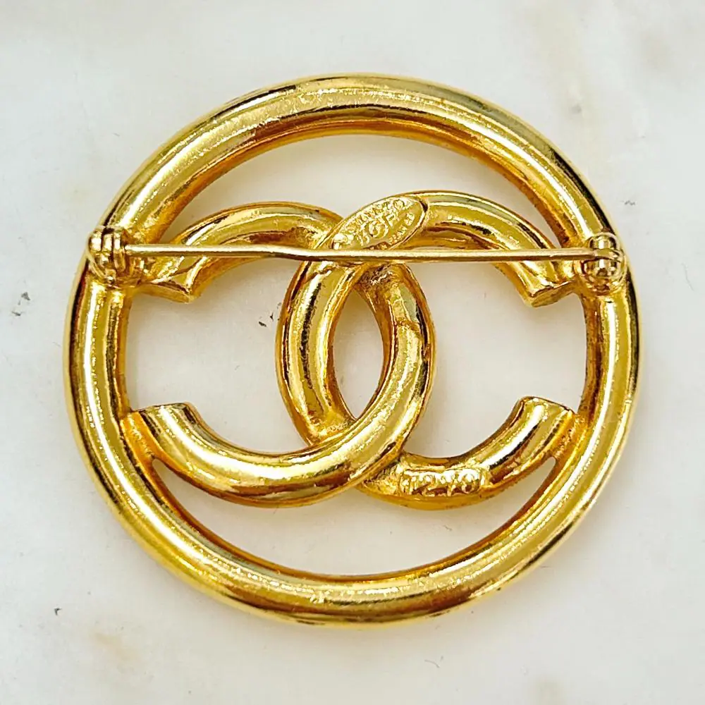 Chanel 1993 gold circle logo brooch