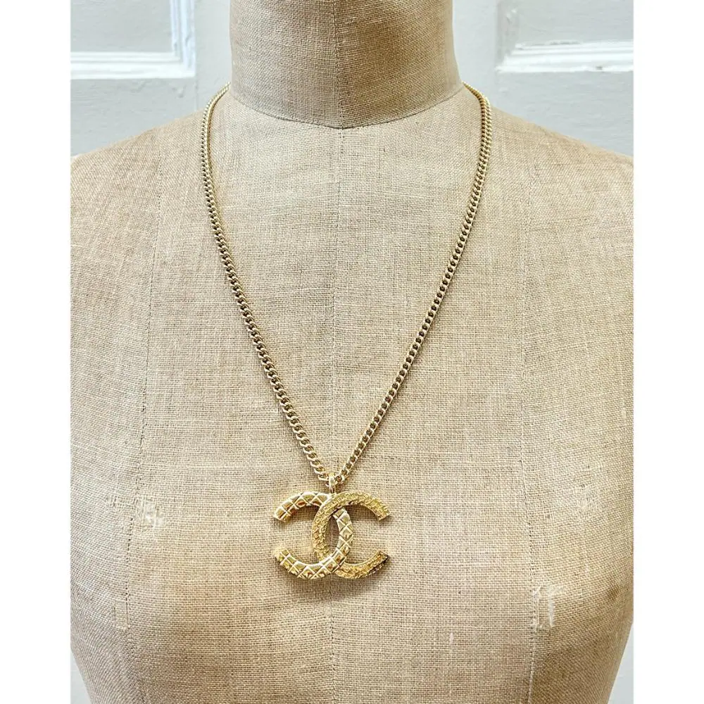 Chanel 2024 gold logo pendent necklace