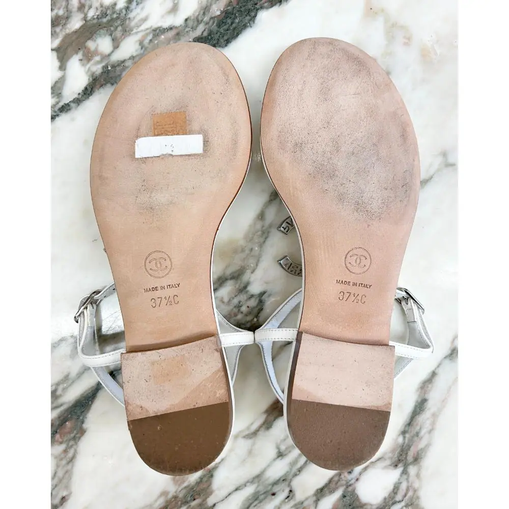 Chanel white leather thong sandals with silver CC ~ sz 37.5 C