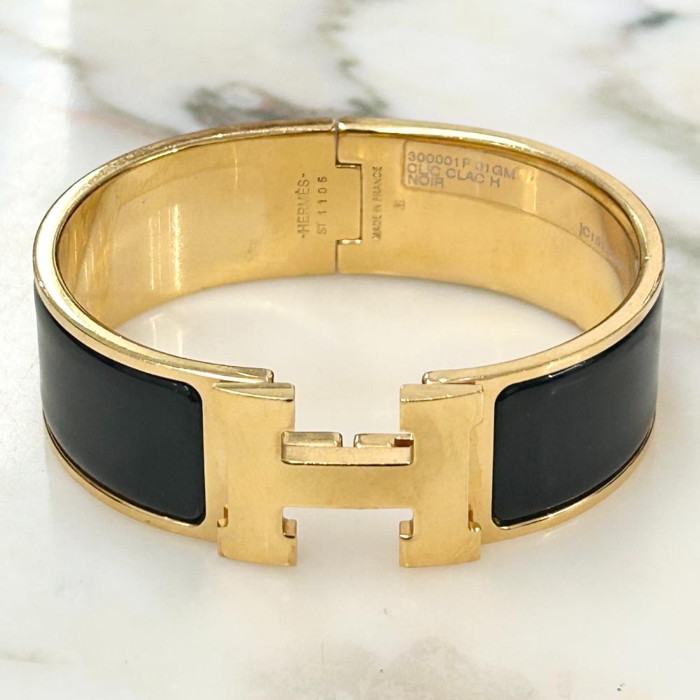 Hermès Clic Clac H bracelet in black enamel and gold plated metal