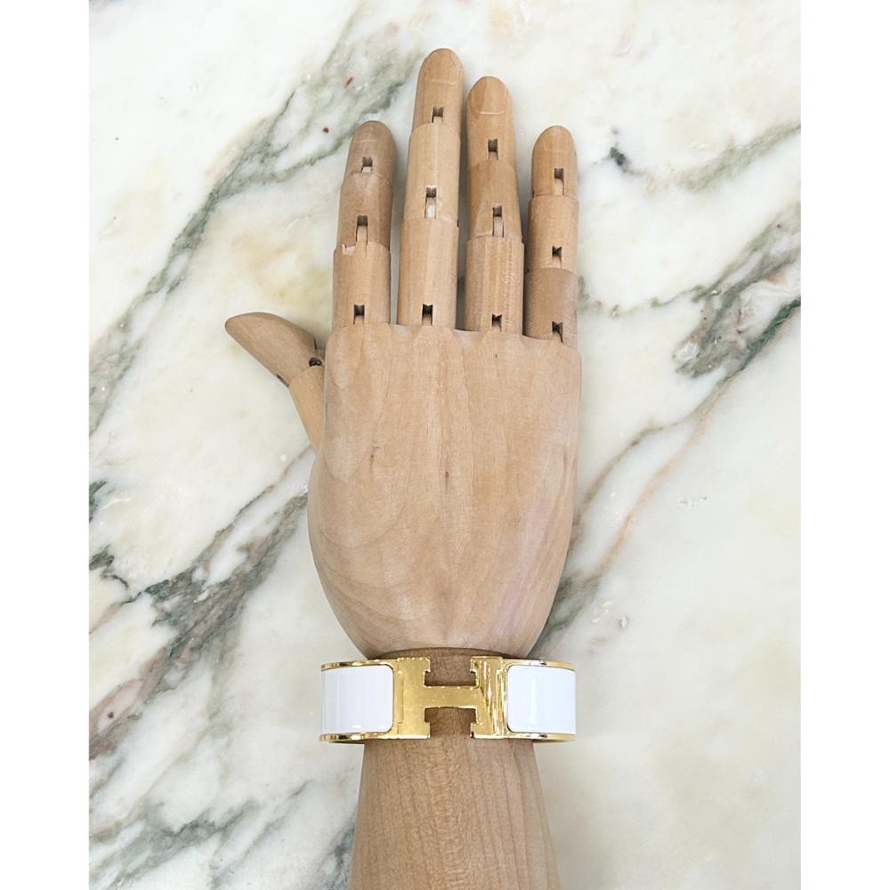 Hermès Clic Clac H bracelet in white enamel and gold plated metal