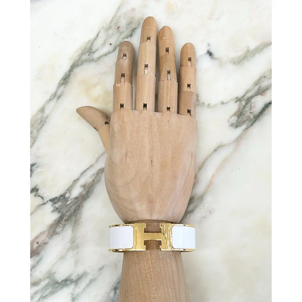 Hermès Clic Clac H bracelet in white enamel and gold plated metal