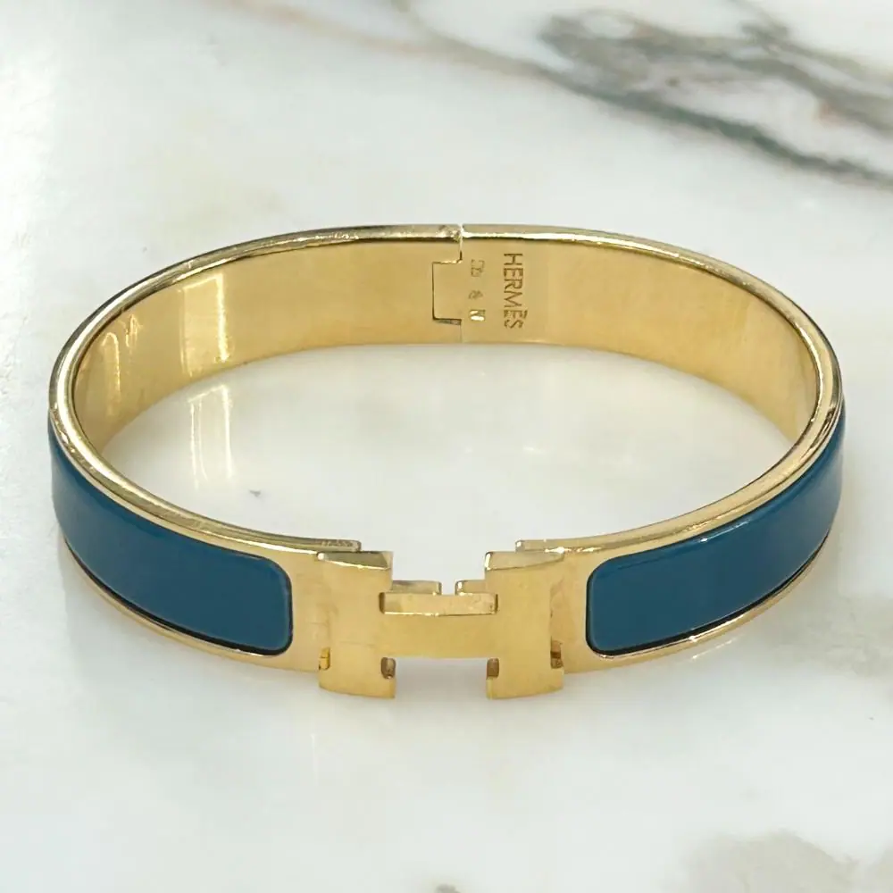 Hermès Clic H bracelet in teal enamel & gold plated metal