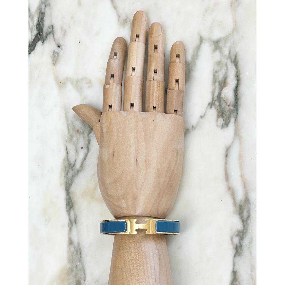 Hermès Clic H bracelet in teal enamel & gold plated metal