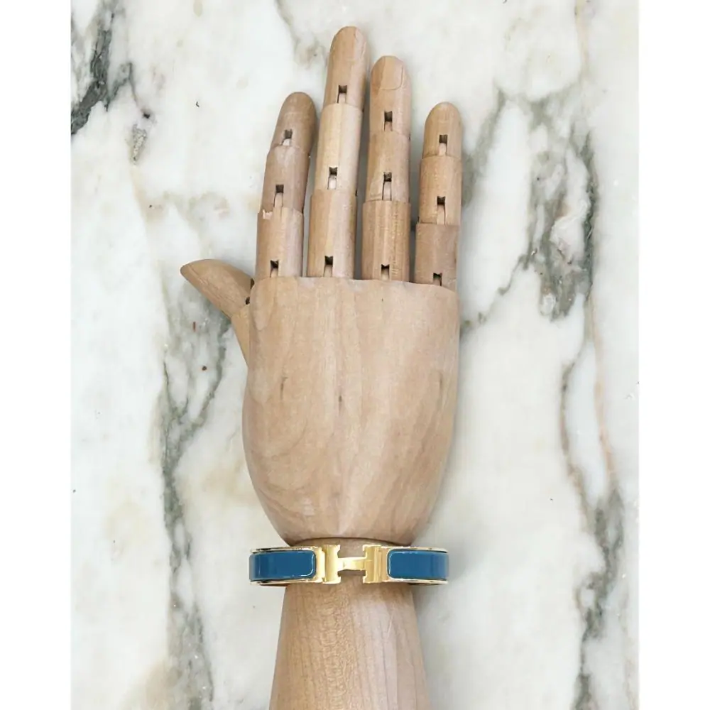 Hermès Clic H bracelet in teal enamel & gold plated metal