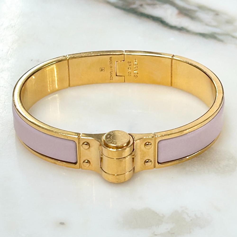Hermès Enamel hinged bracelet in light pink and gold plated metal