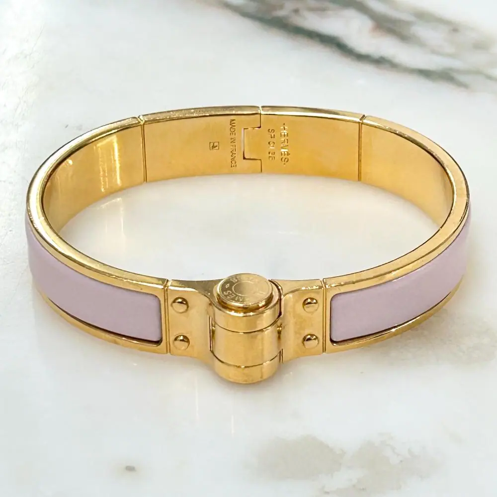 Hermès Enamel hinged bracelet in light pink and gold plated metal