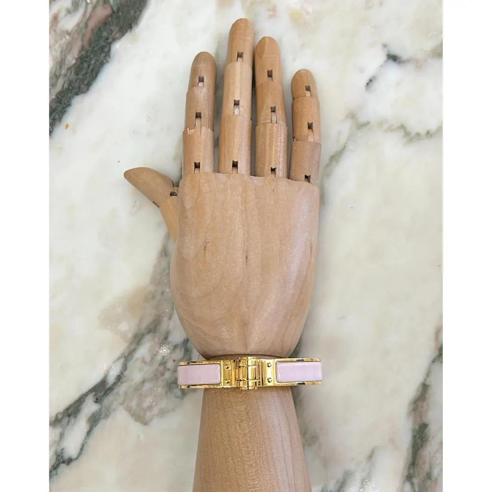 Hermès Enamel hinged bracelet in light pink and gold plated metal