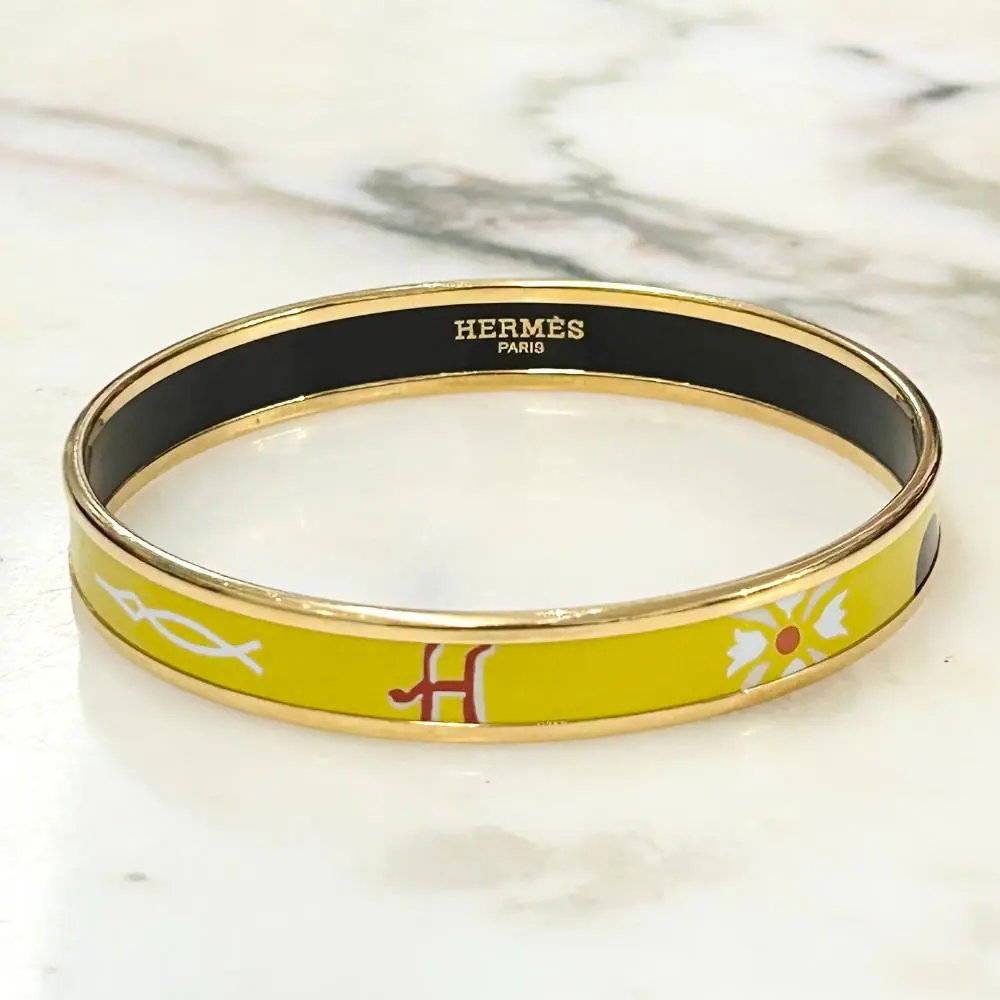 Hermès enamel abstract print bangle with gold plated trim