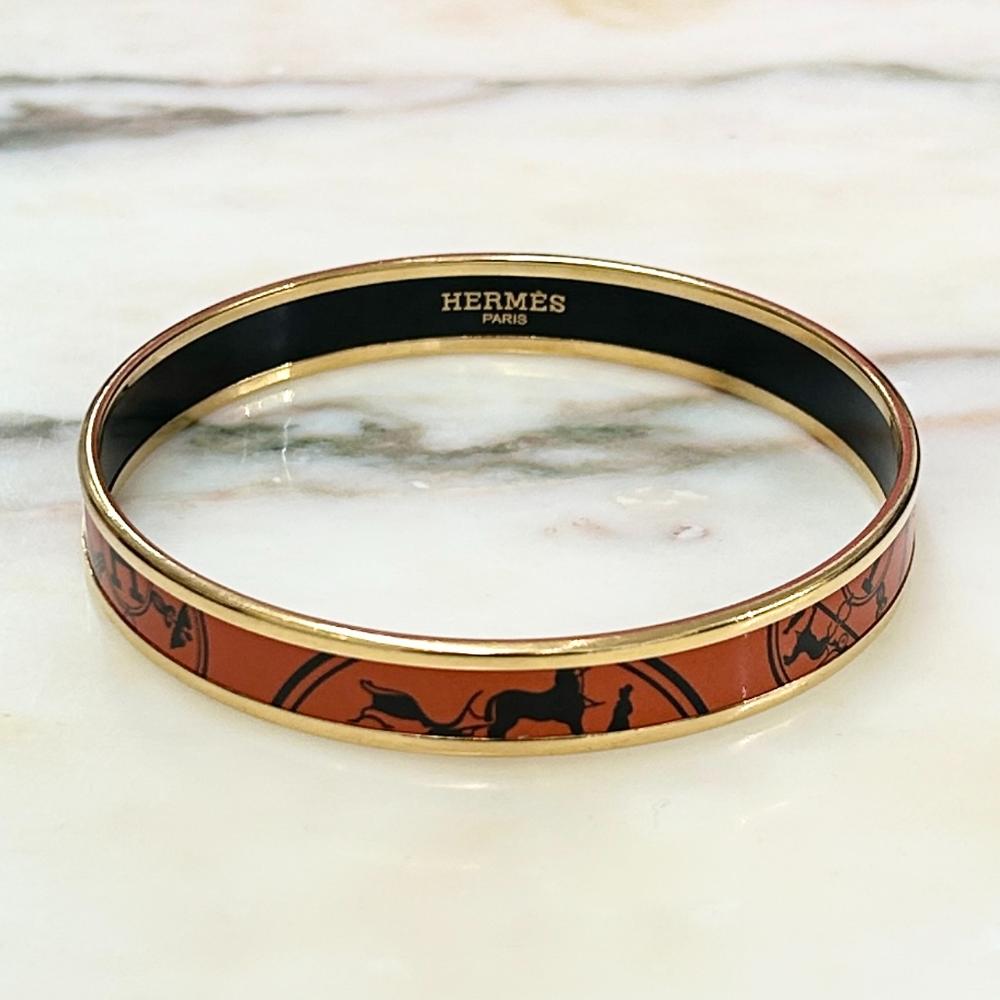 Hermès enamel orange Confetti d'Ex-Libris bangle with gold trim