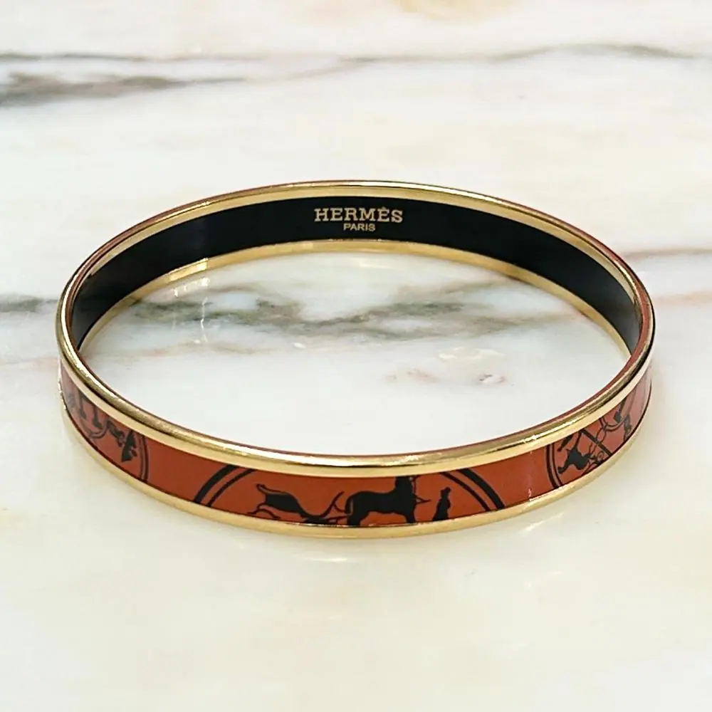 Hermès enamel orange Confetti d'Ex-Libris bangle with gold trim