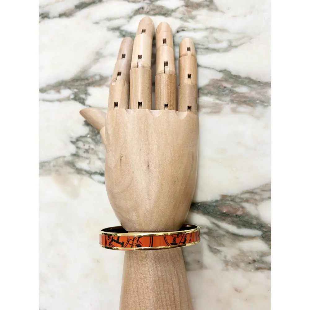 Hermès enamel orange Confetti d'Ex-Libris bangle with gold trim