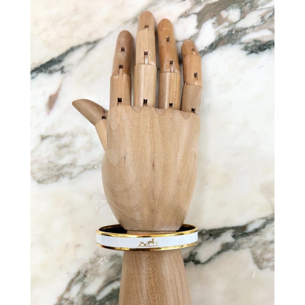Hermès white enamel Caleche bangle with gold trim