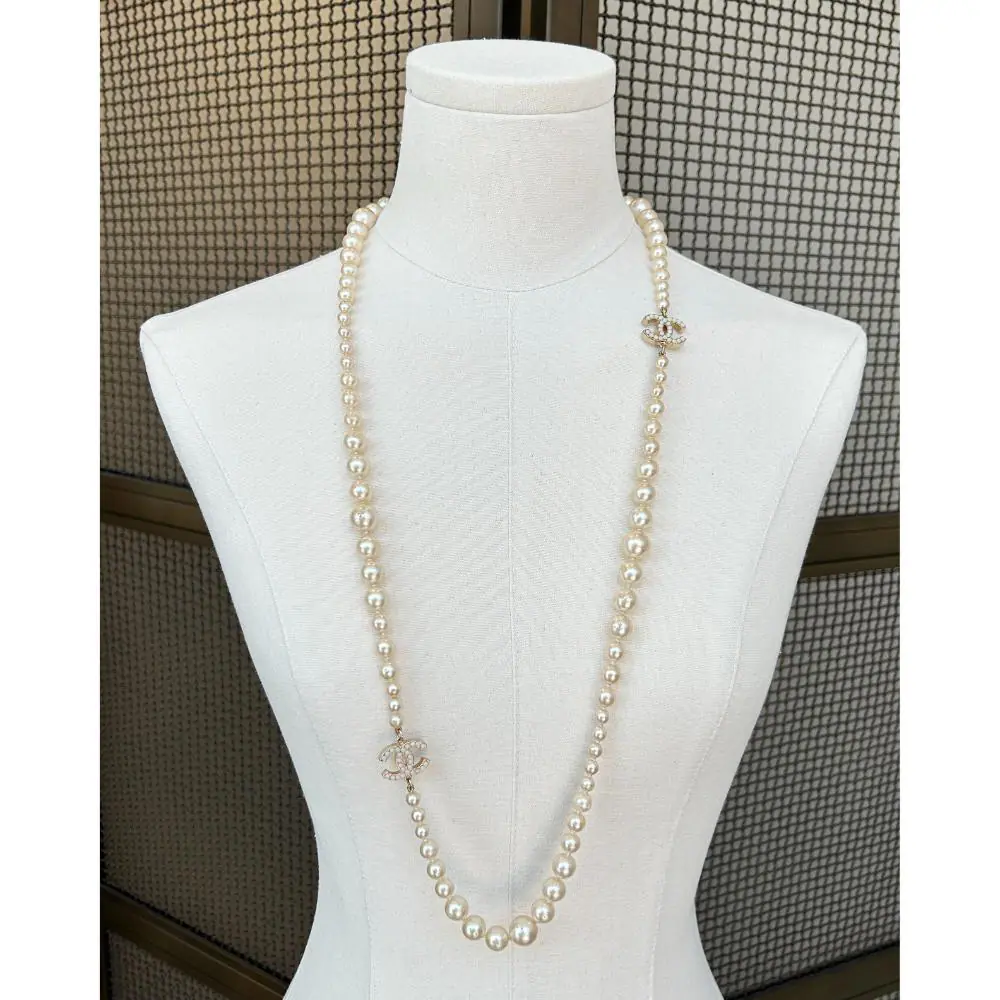 Chanel 2007 long pearl necklace with gold & pearl logo charms