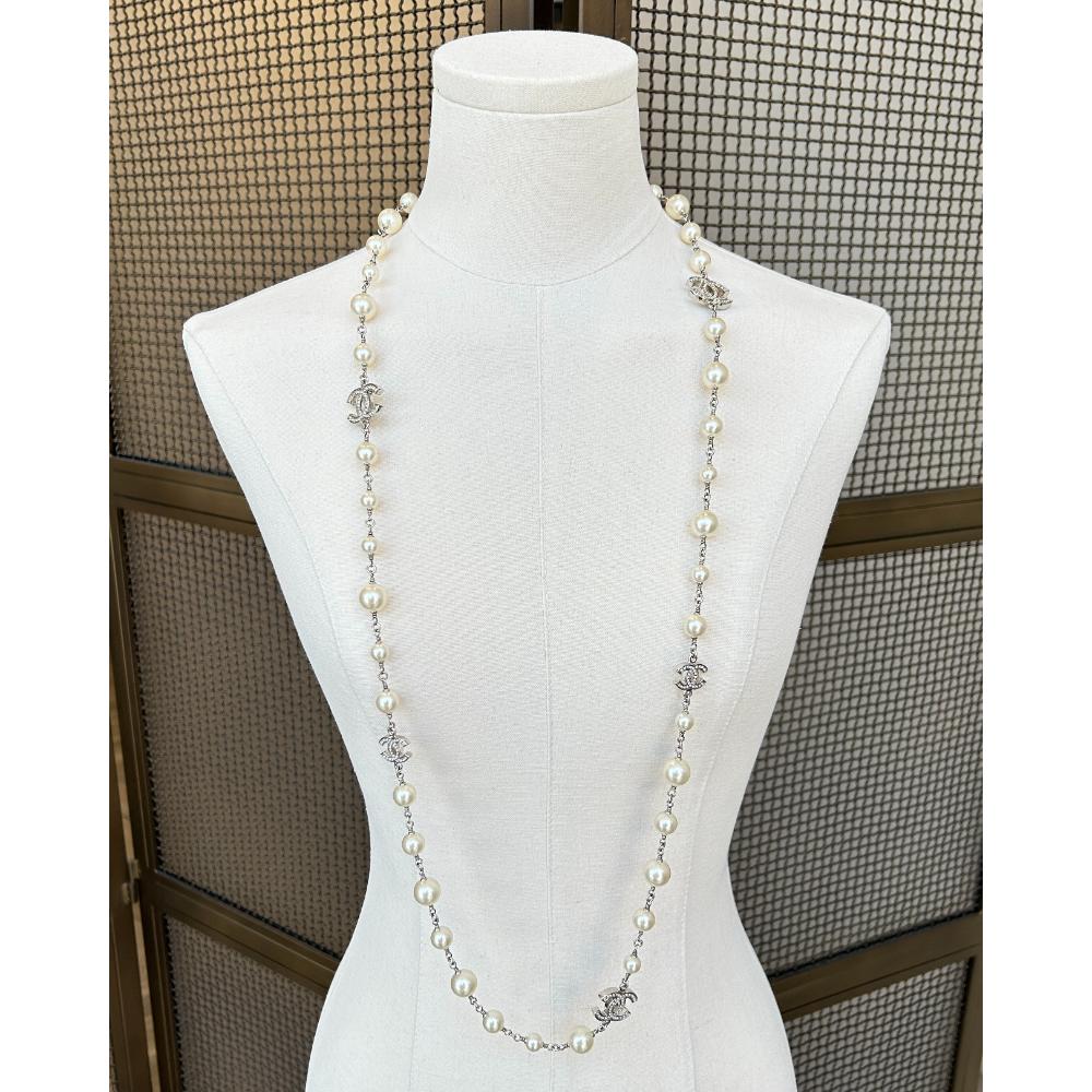 Chanel 2011 long pearl necklace with crystal logo charms