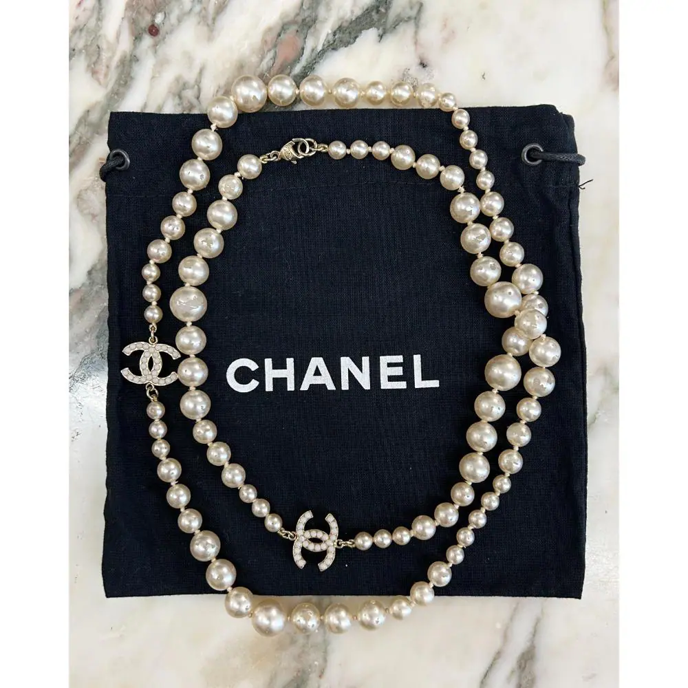 Chanel 2007 long pearl necklace with gold & pearl logo charms
