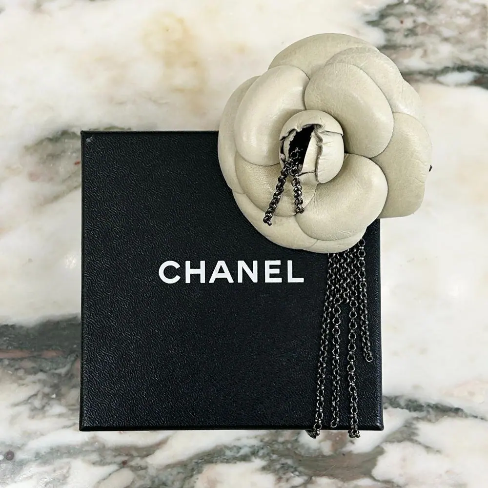 Chanel 2002 ecru leather camellia brooch w/ gunmetal silver chains