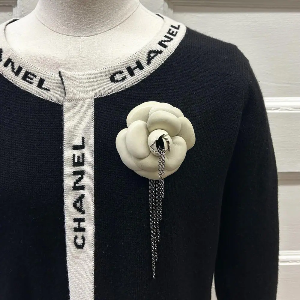 Chanel 2002 ecru leather camellia brooch w/ gunmetal silver chains