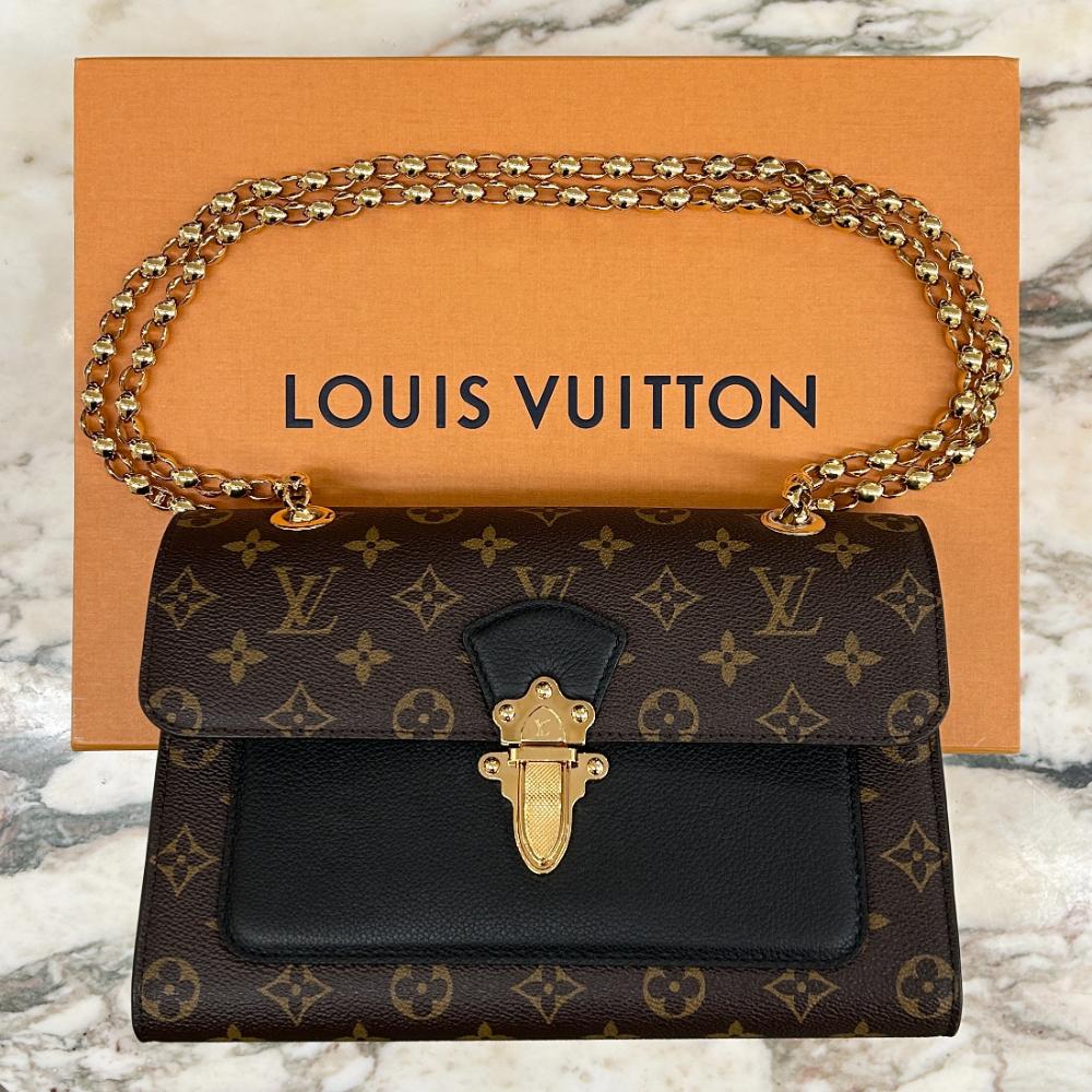 Louis Vuitton Victoire bag in Monogram and black leather