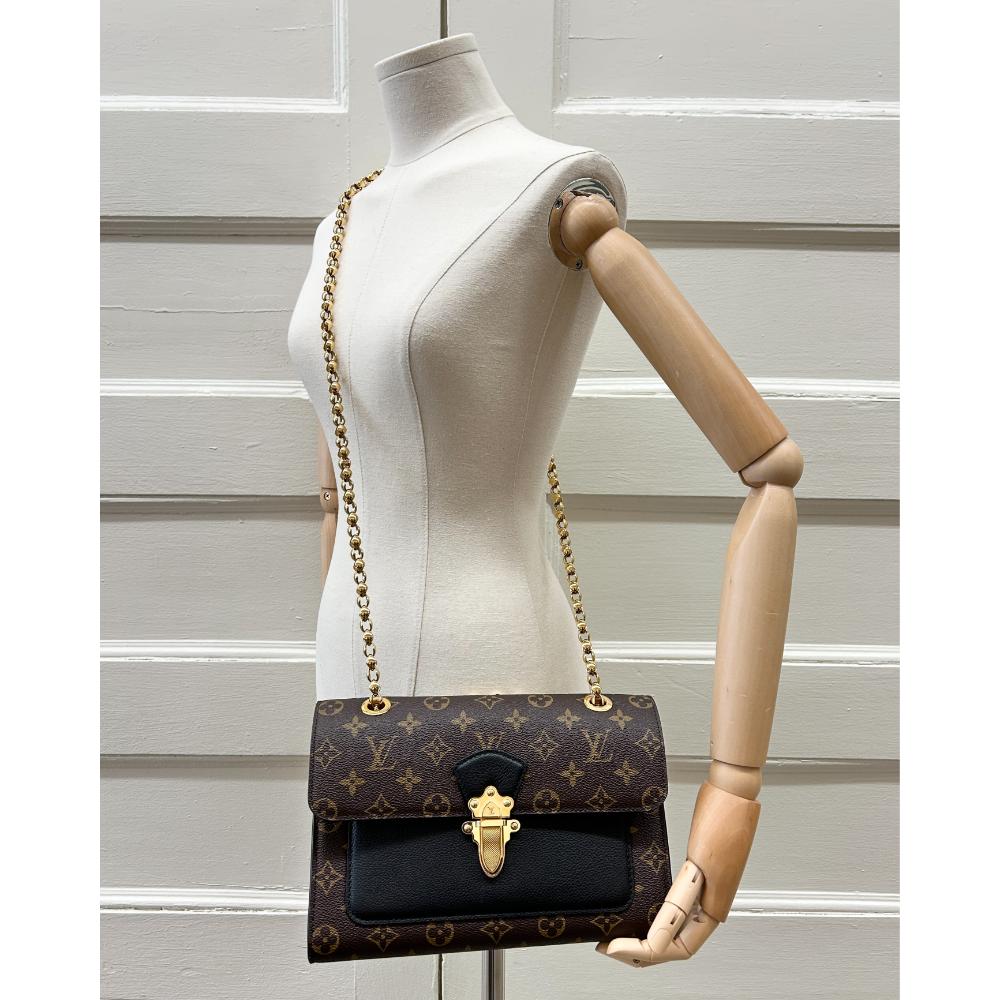 Louis Vuitton Victoire bag in Monogram and black leather