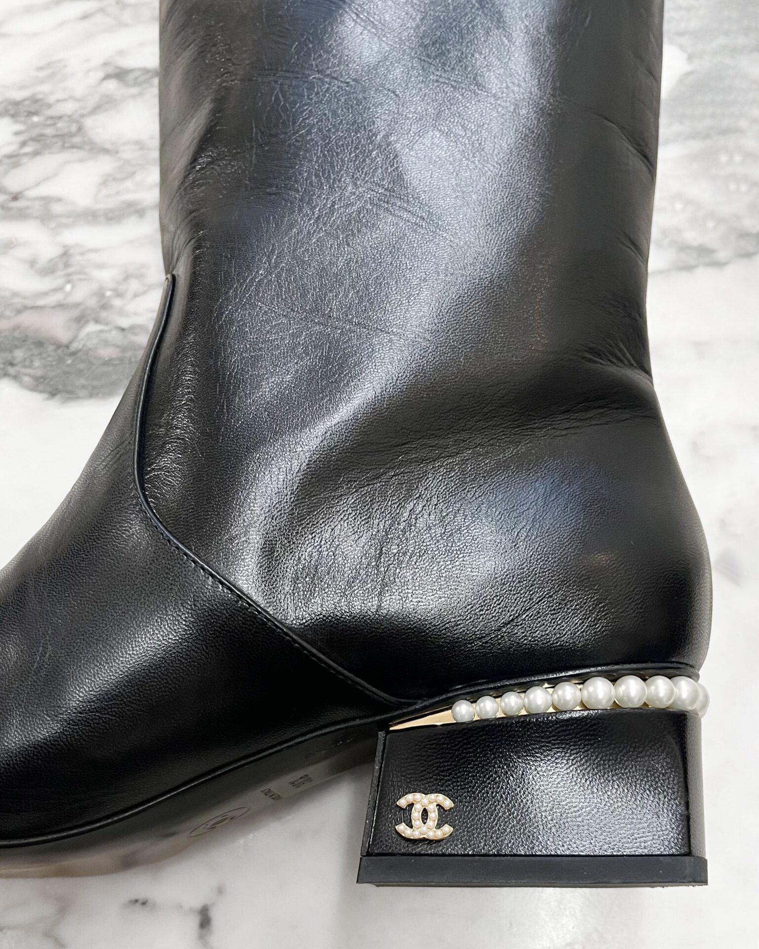 Chanel black leather boots with pearl block heel