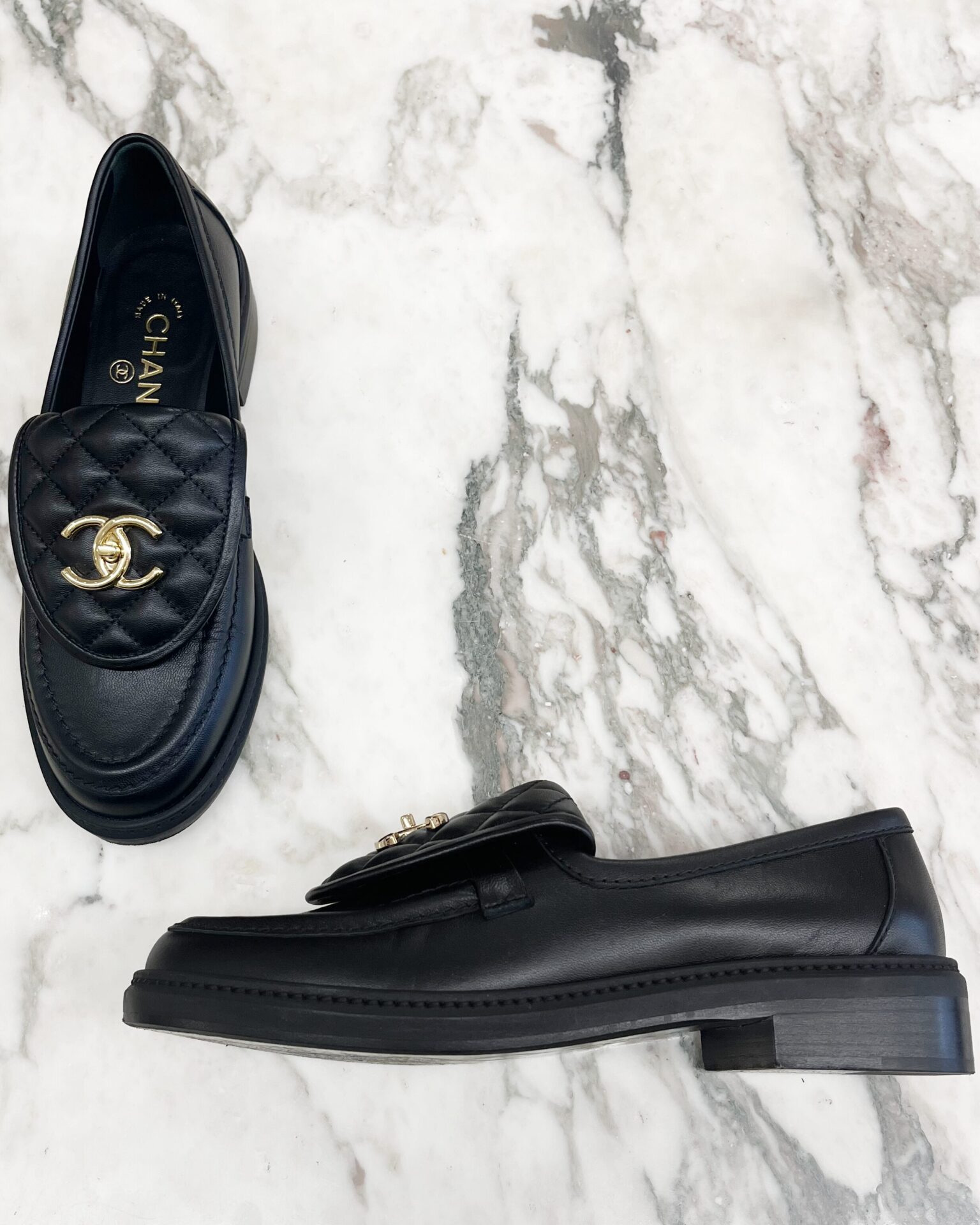 Chanel black quilted leather turn lock loafers