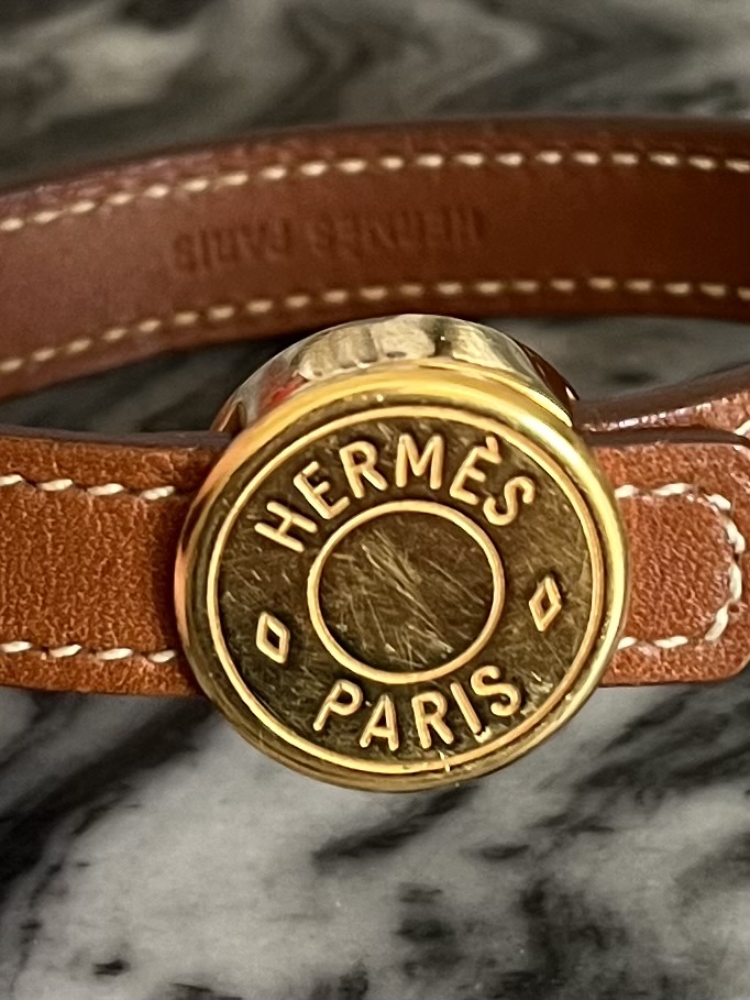 Hermes 2009 looping leather bracelet in cognac & gold