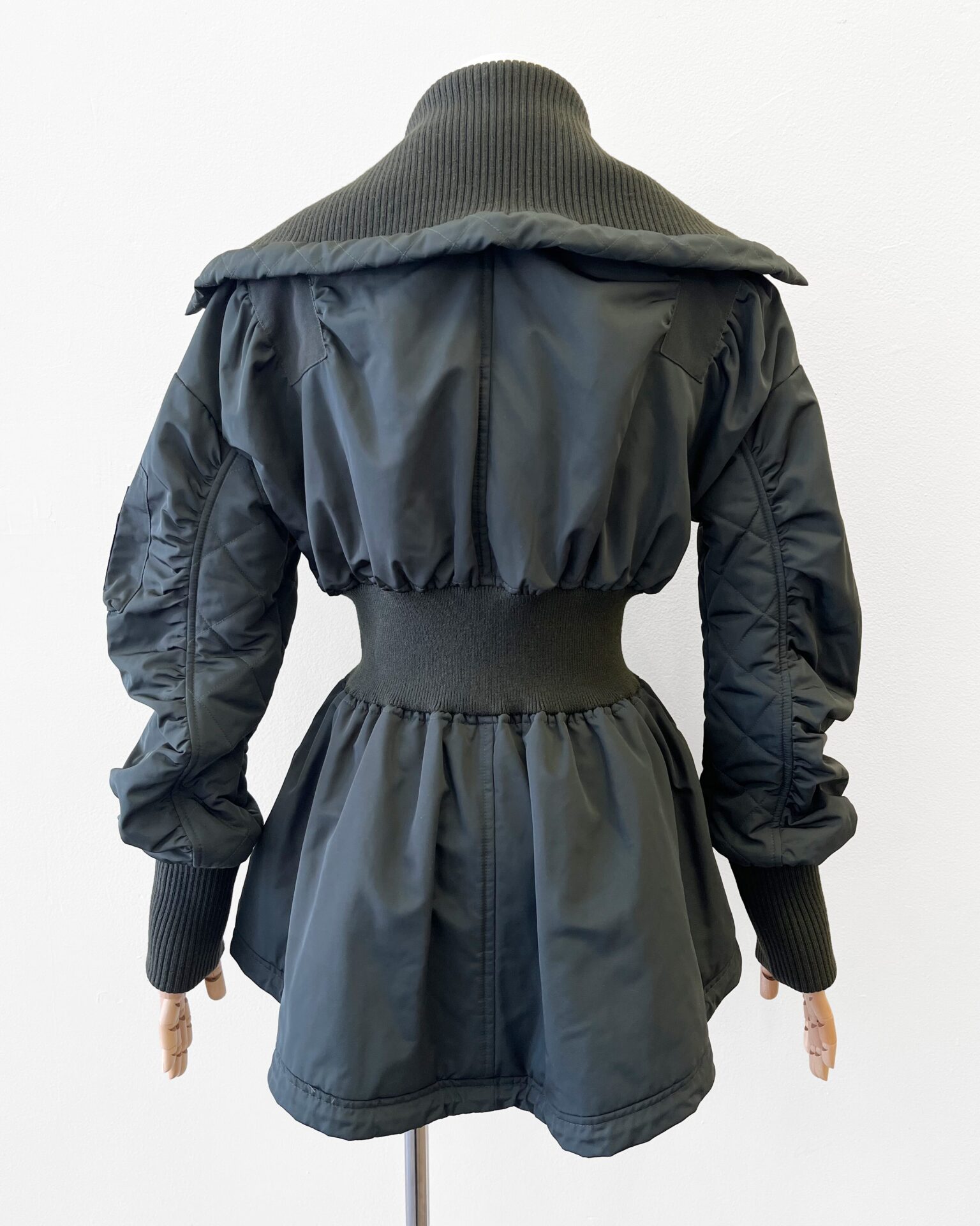 Alexander McQueen green peplum bomber jacket