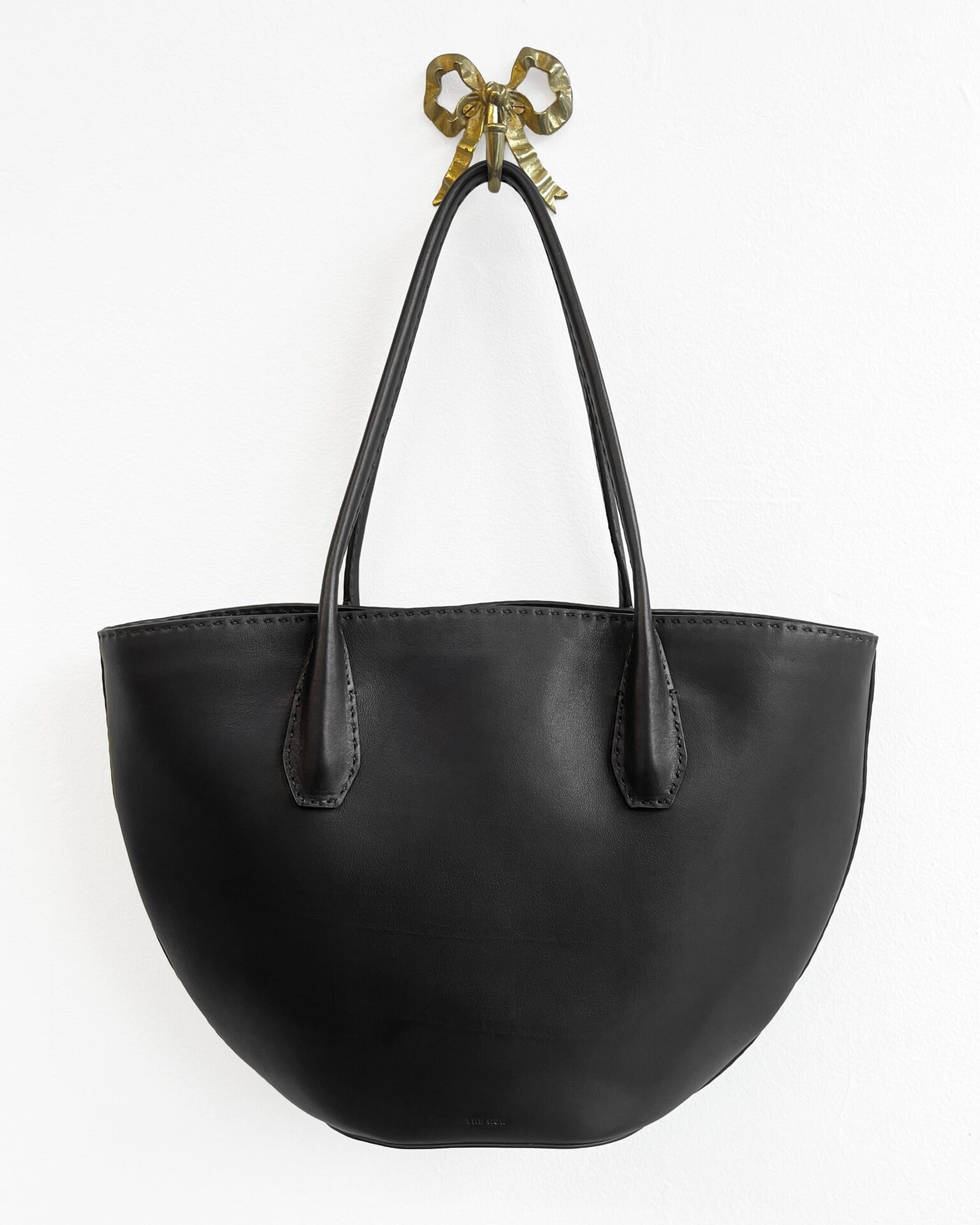 The Row Algen tote in black polished saddle leather