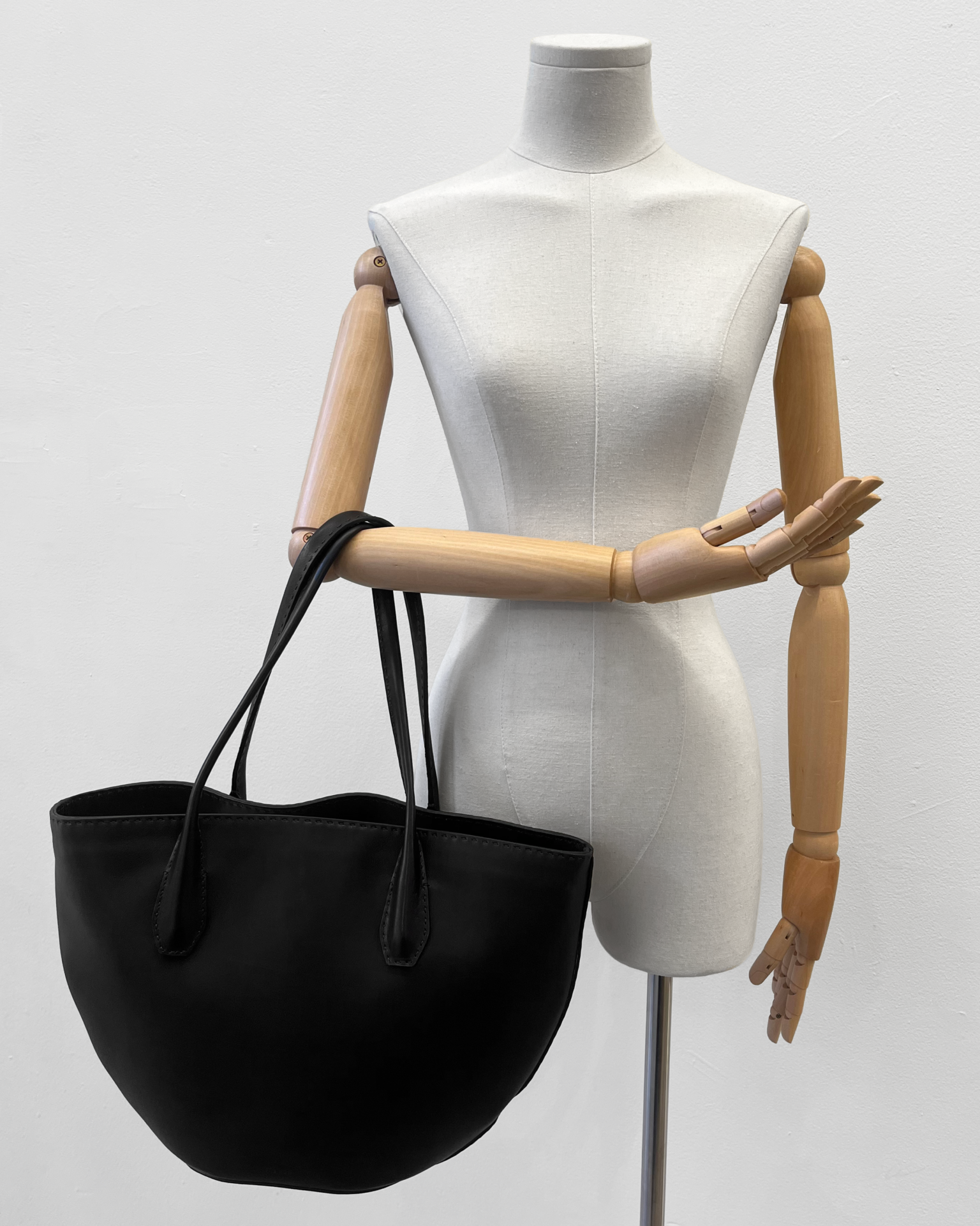 The Row Algen tote in black polished saddle leather