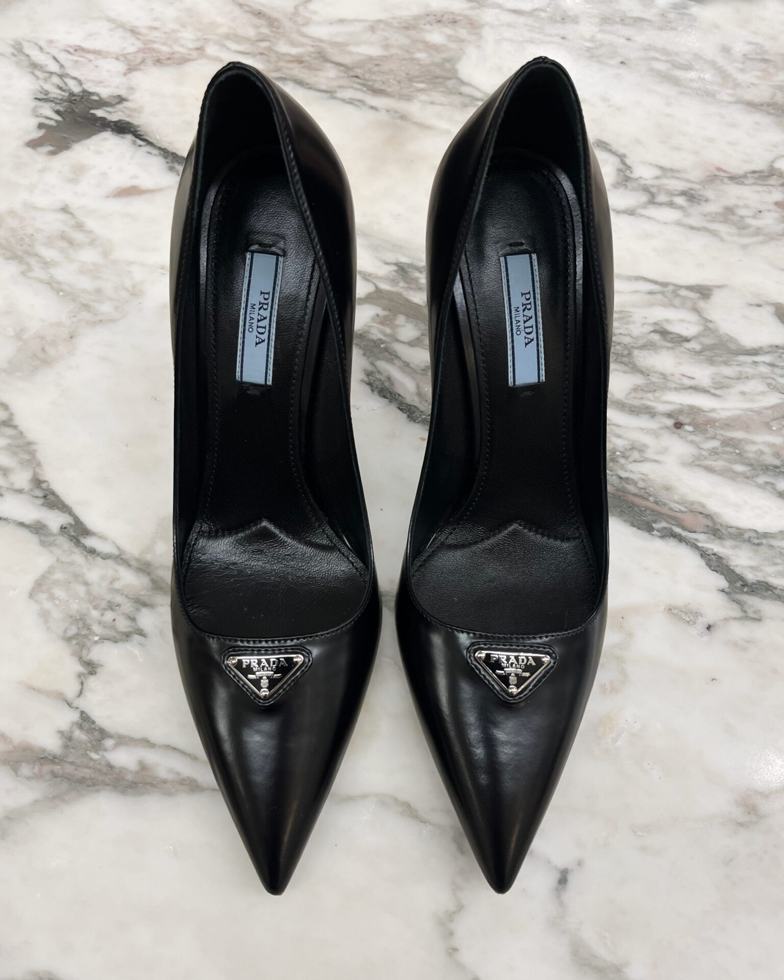 Prada brushed leather logo pumps in black