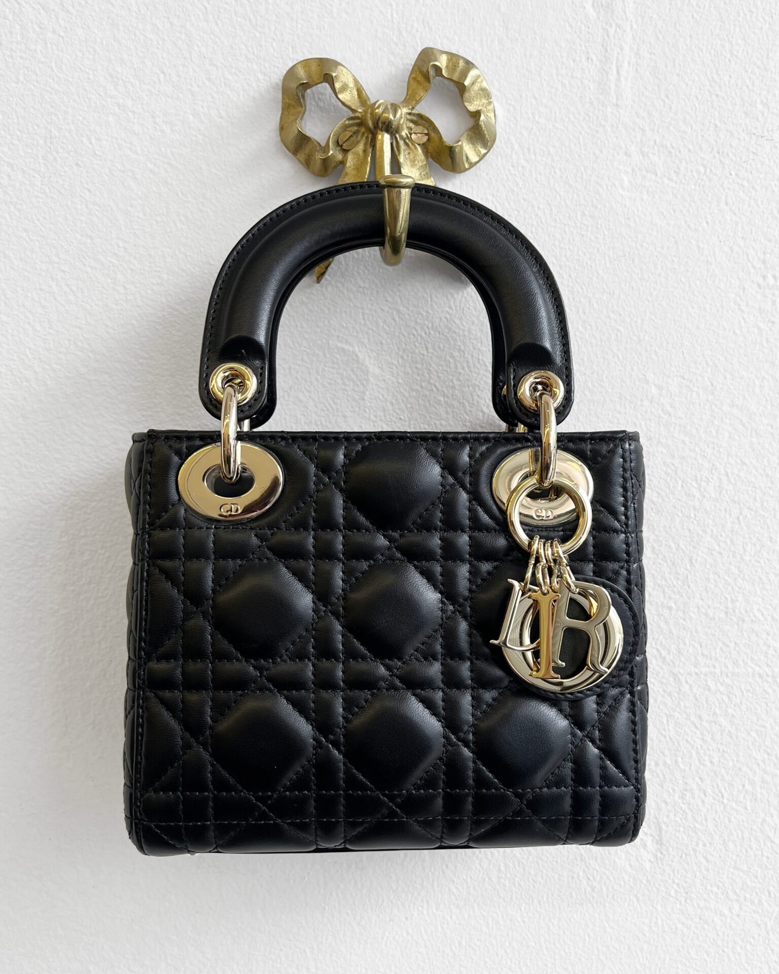 Dior mini Lady Dior bag in black Cannage lambskin with strap
