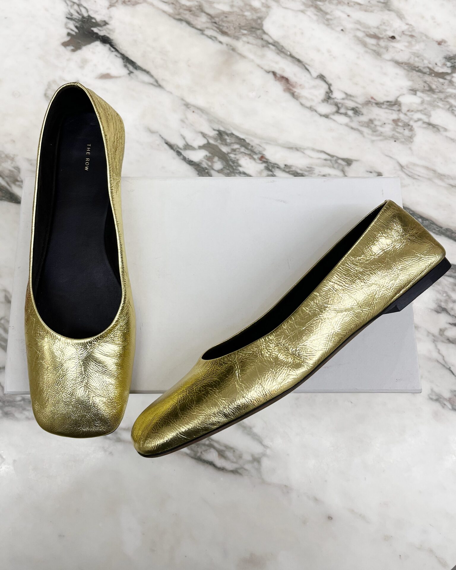 The Row square toe ballet flats in gold