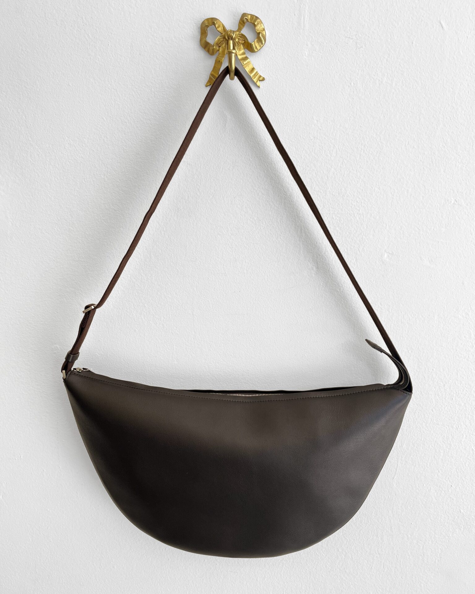The Row Crescent Bag in chocolate leather