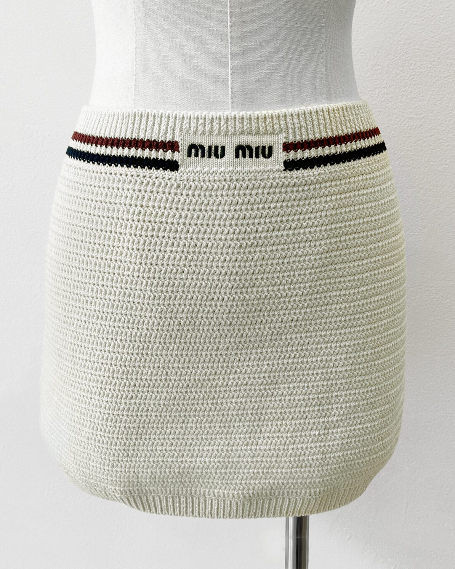 Miu Miu beige cotton knit mini skirt with navy embroidered logo