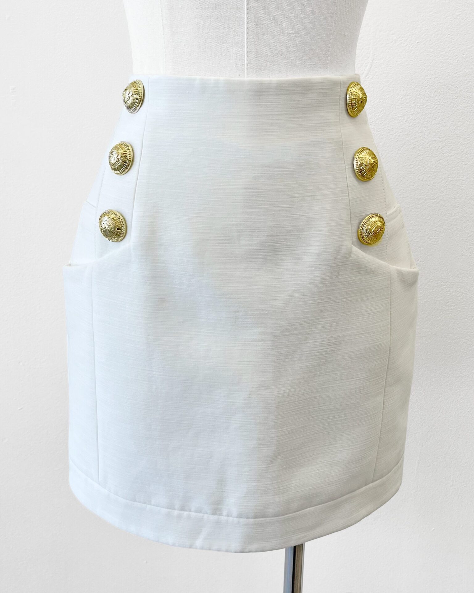Balmain cream cotton mini skirt with crest buttons