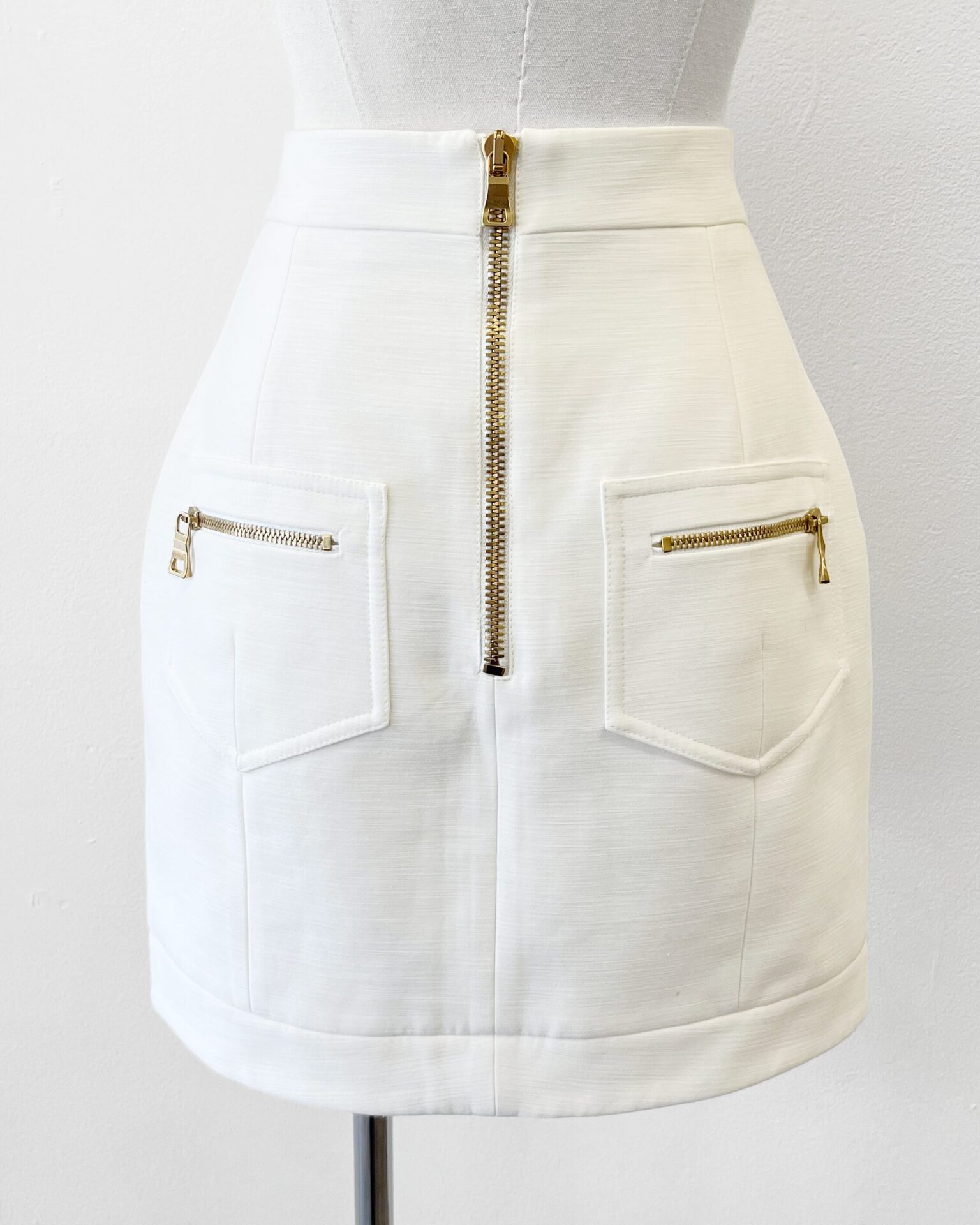 Balmain cream cotton mini skirt with crest buttons