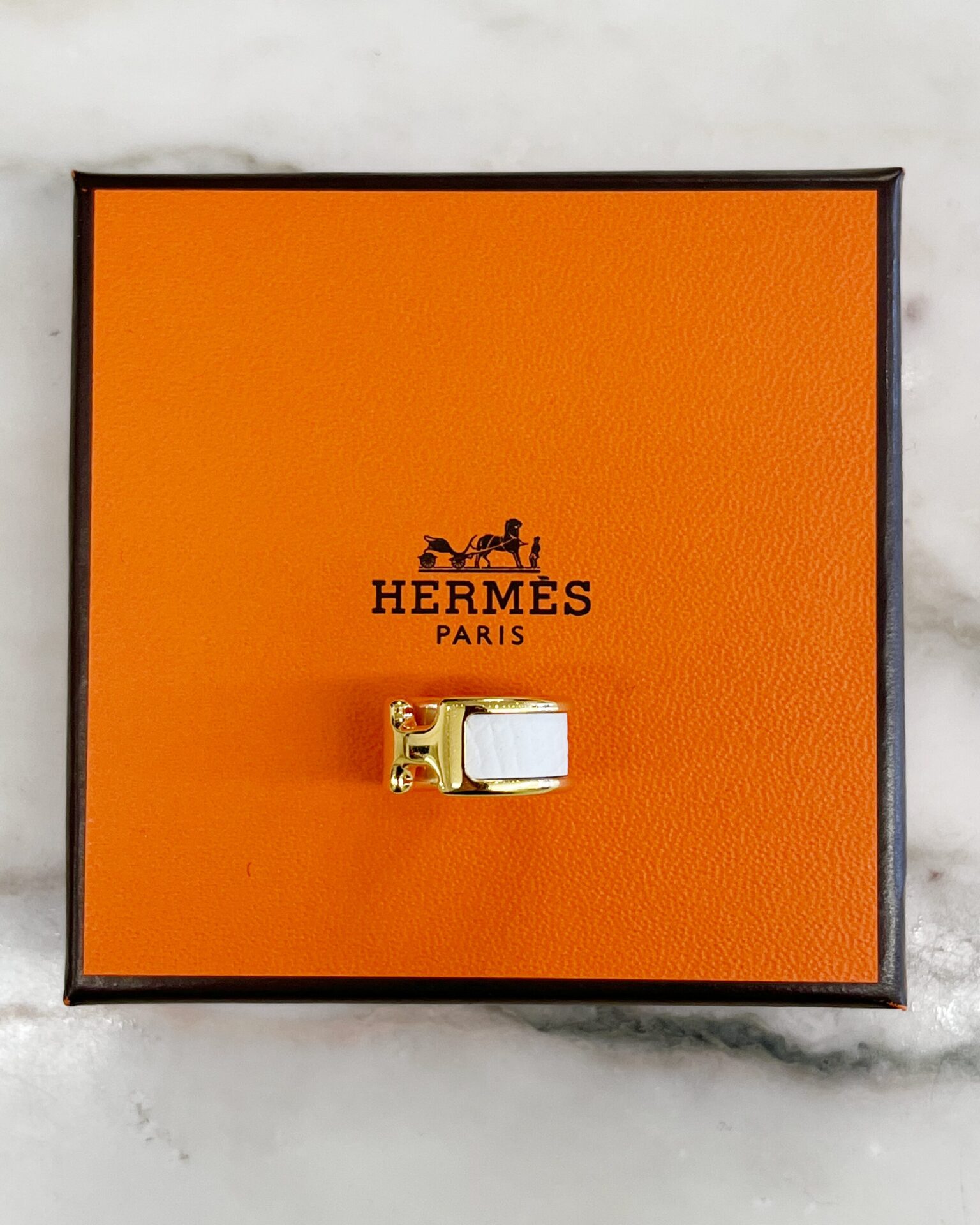 Hermes Olympe earcuff PM in white calf