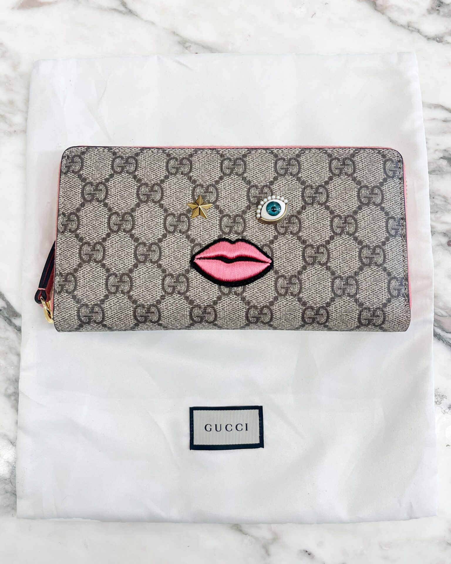 Gucci GG Supreme Monogram embroidered face zip wallet