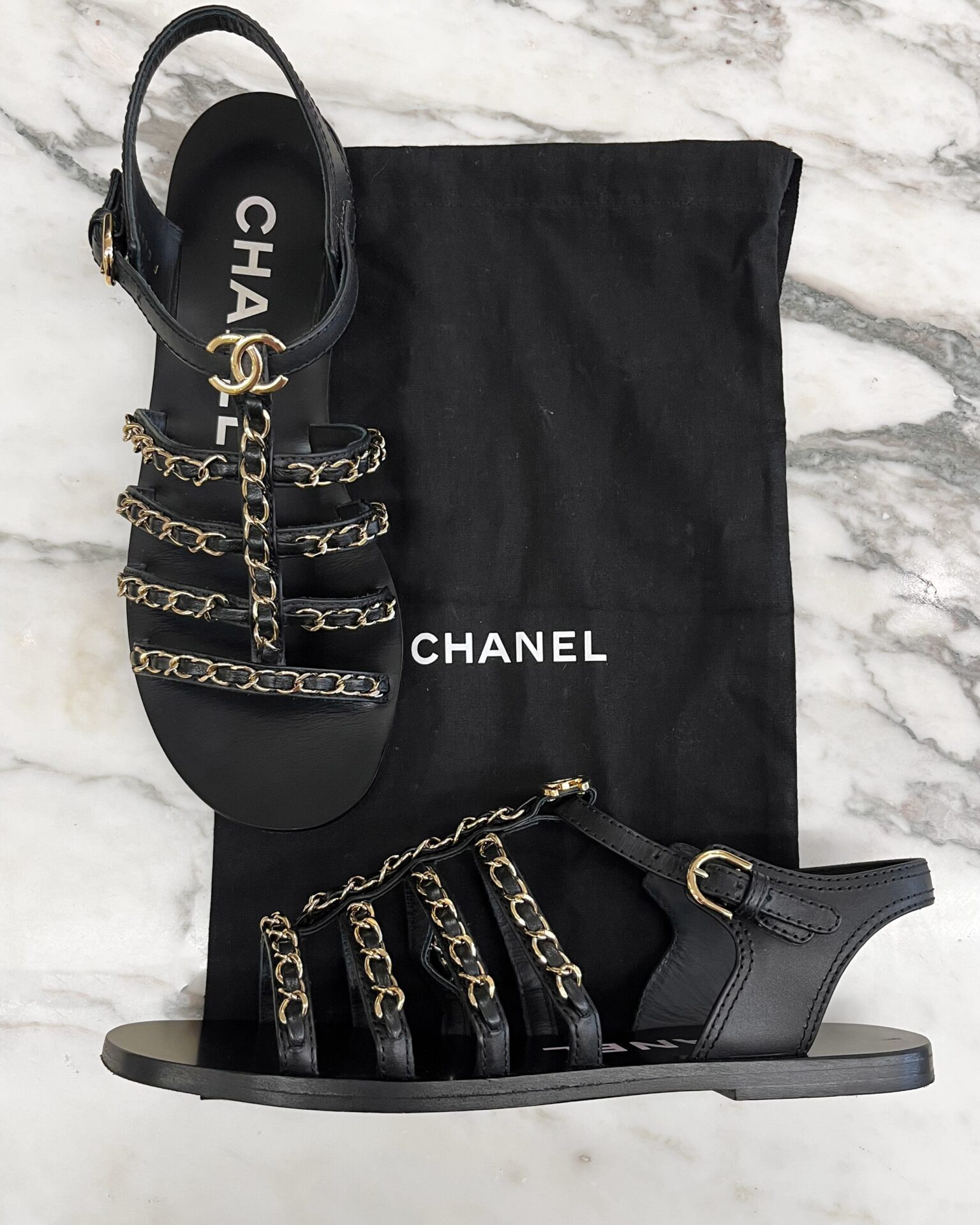 Chanel 2023 black strappy flat sandals with gold chains