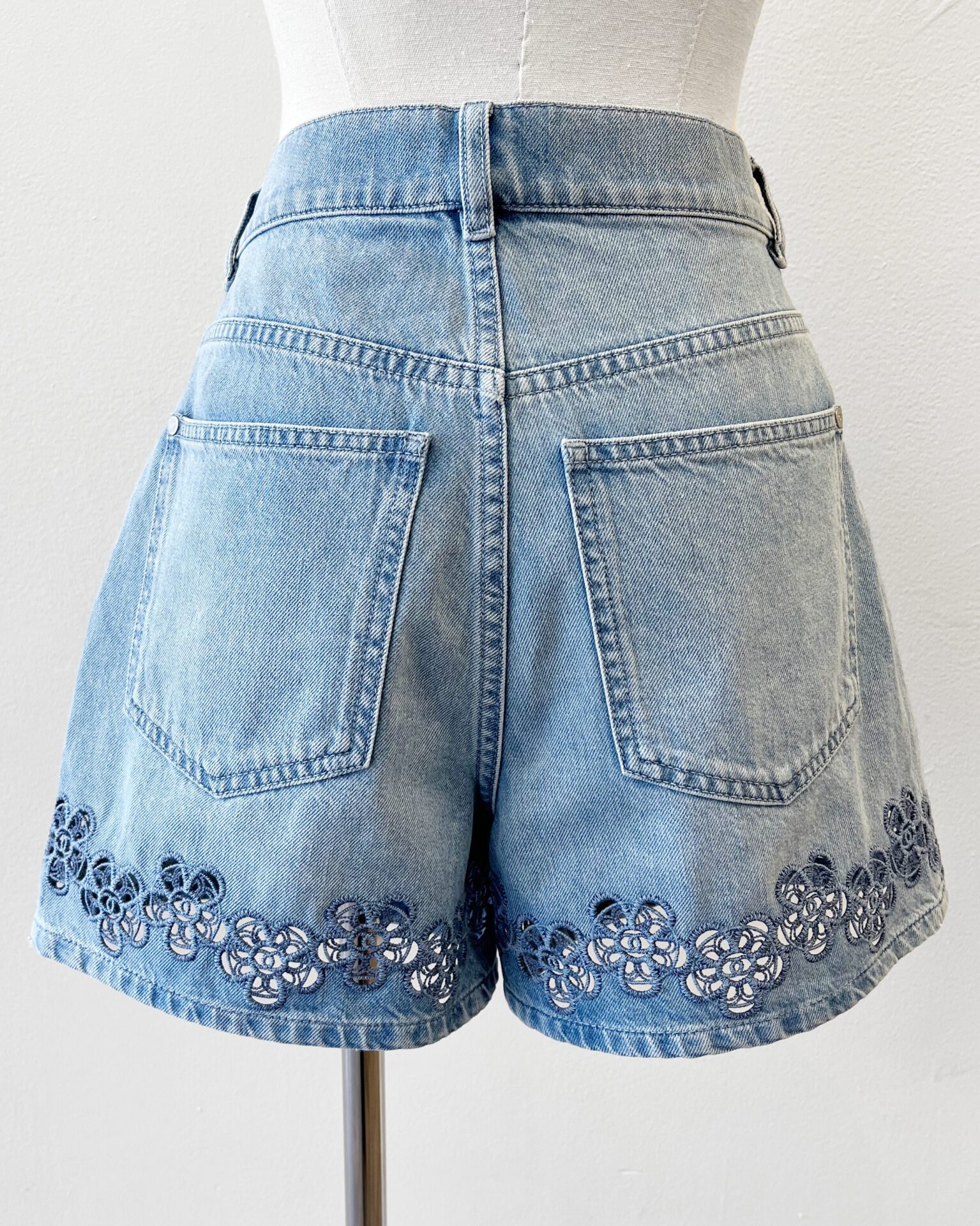Chanel 2024 denim shorts with floral logo embroidered hem