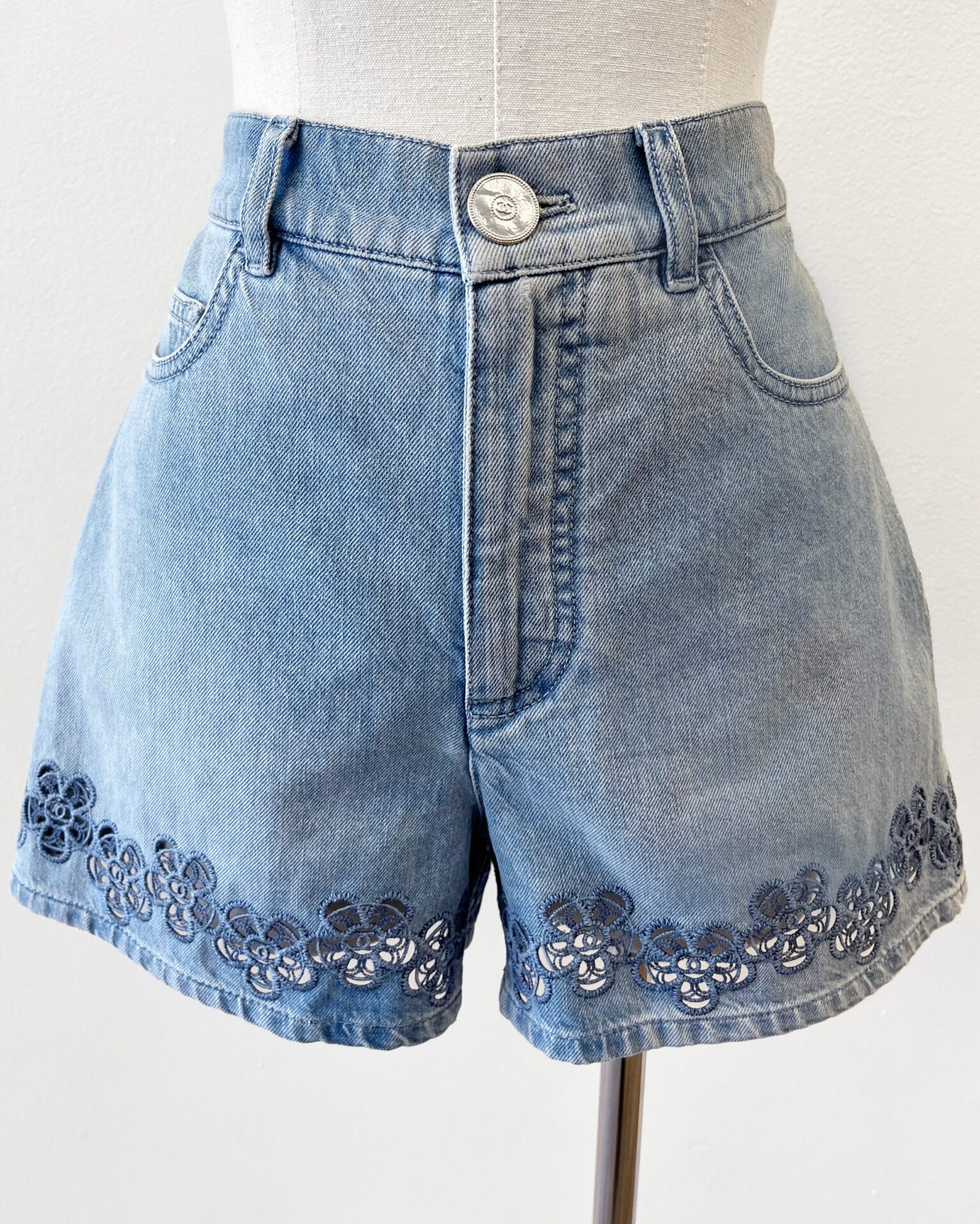 Chanel 2024 denim shorts with floral logo embroidered hem