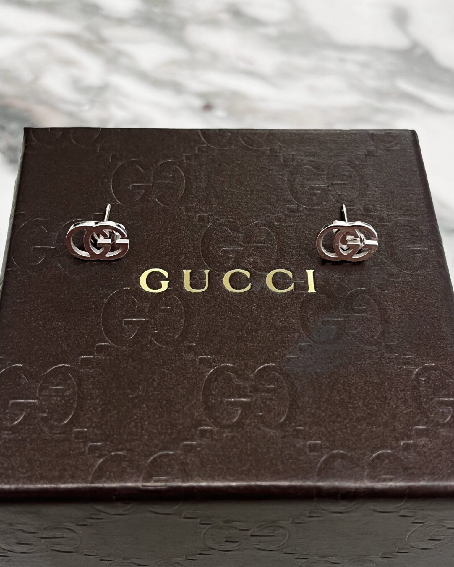 Gucci 18k white gold interlocking GG logo stud earrings