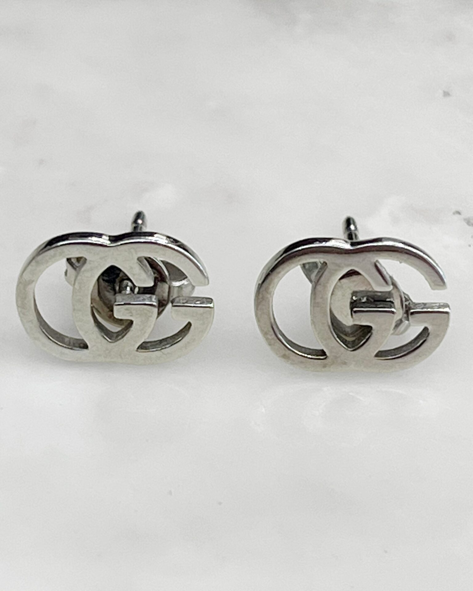 Gucci 18k white gold interlocking GG logo stud earrings