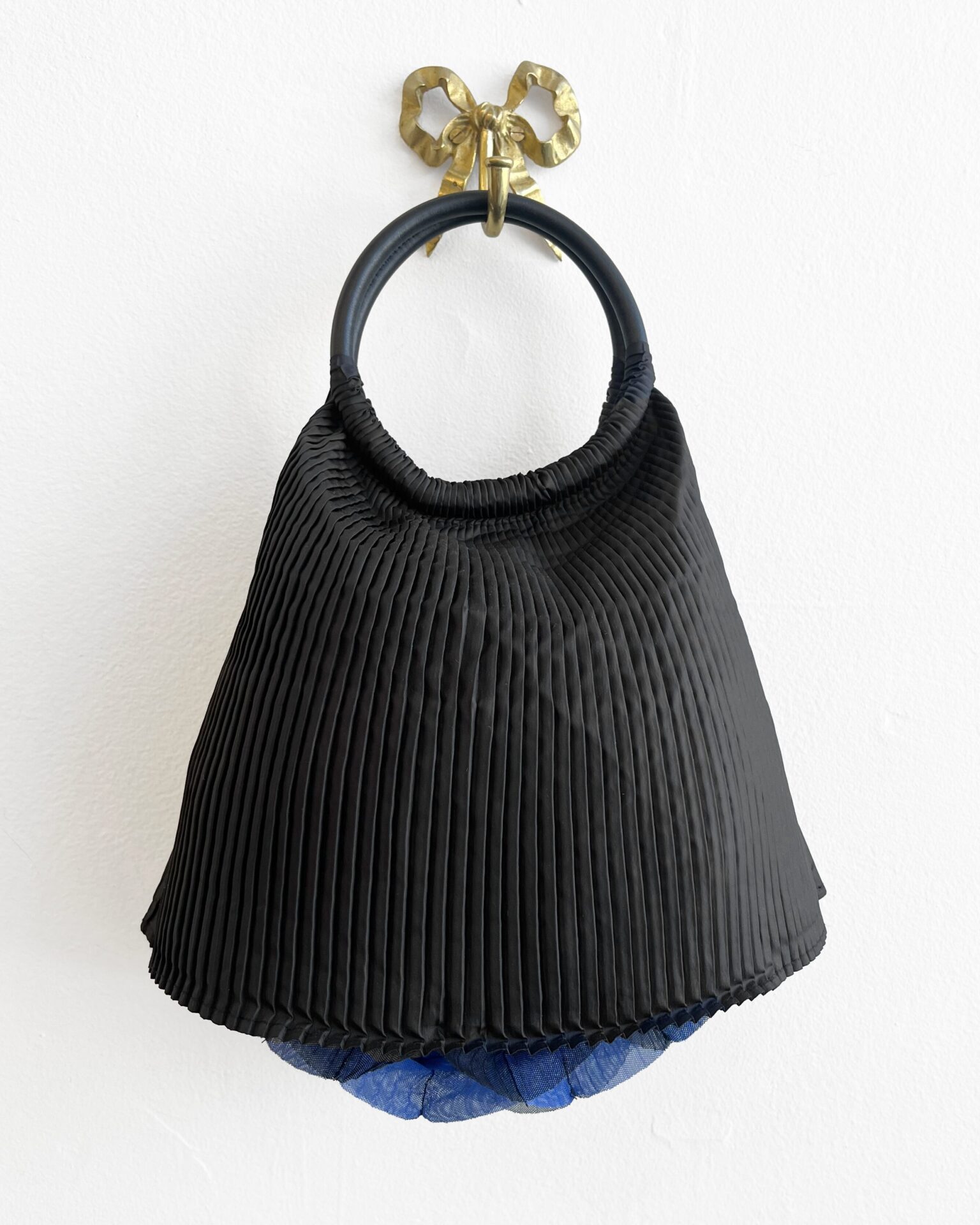 Issey Miyake Pleats Please black purse with indigo latticed bottom