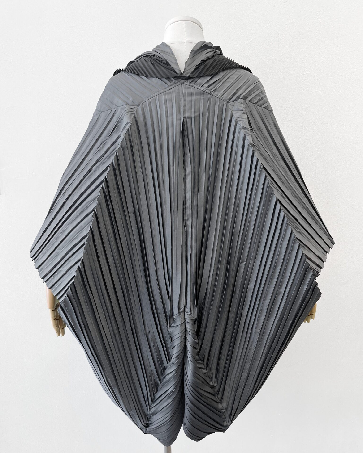 Issey Miyake grey pleated cocoon coat with black scarf