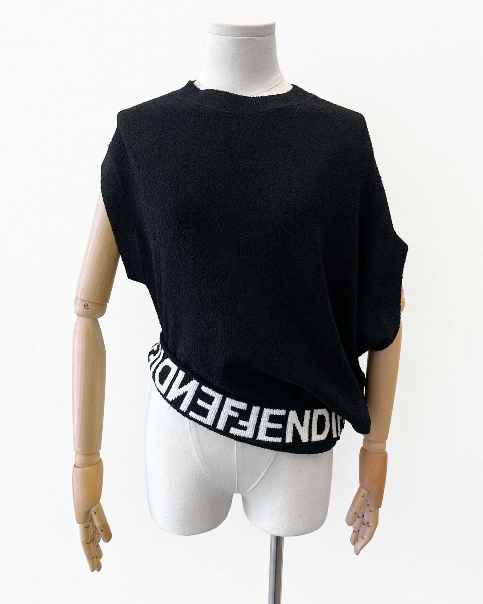 Fendi black asymmetrical knit short sleeve sweater with logo inner band